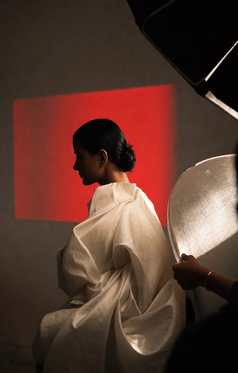 A portrait sitting with a red light projection