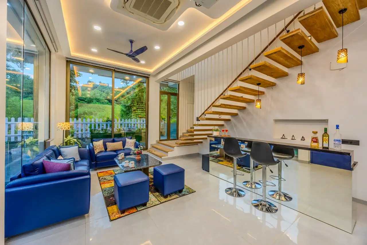 Living room and floating staircase, Glass Villa