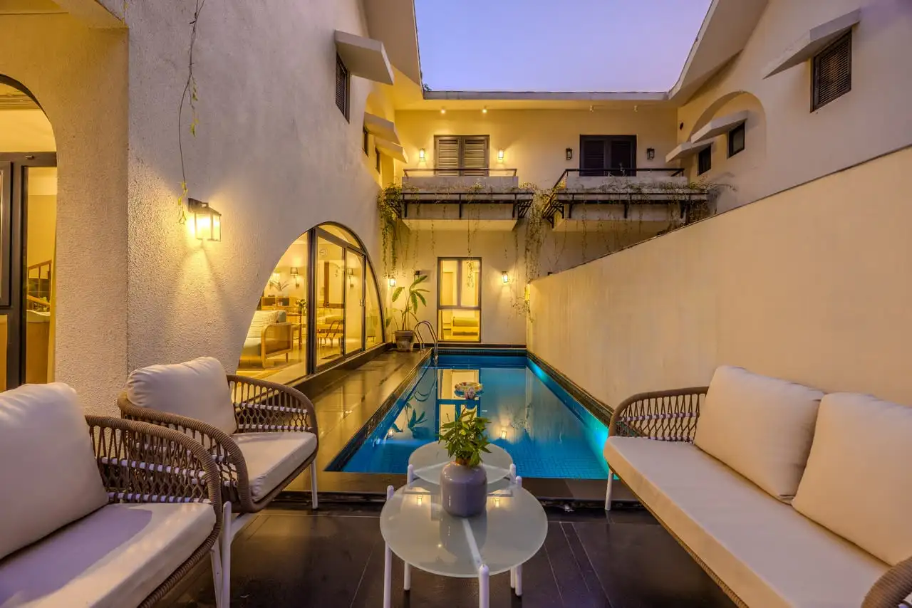 Poolside lounge at dusk, IDA Villa 12